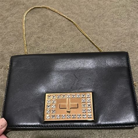 michael kors black and gold clutch
